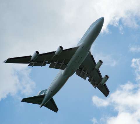 aircraft climbing into sky